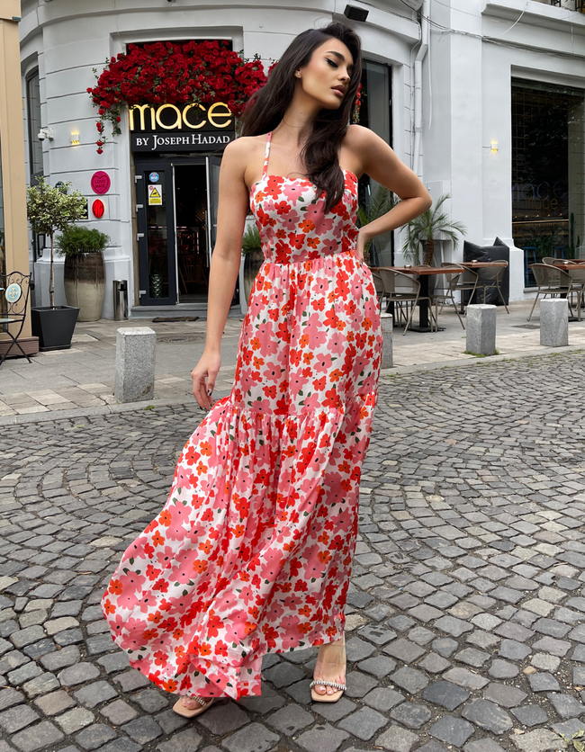 woman in a red floral maxi dress pattern