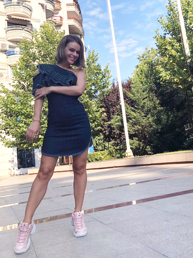 woman sporting a casual denim mini dress
