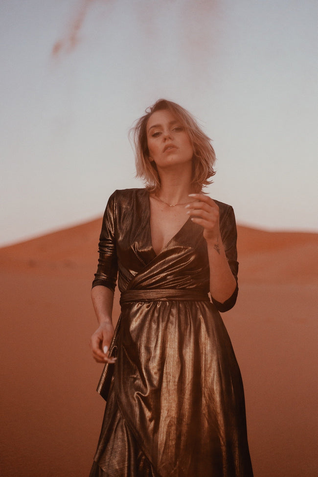 woman wearing a maxi dress in a dessert