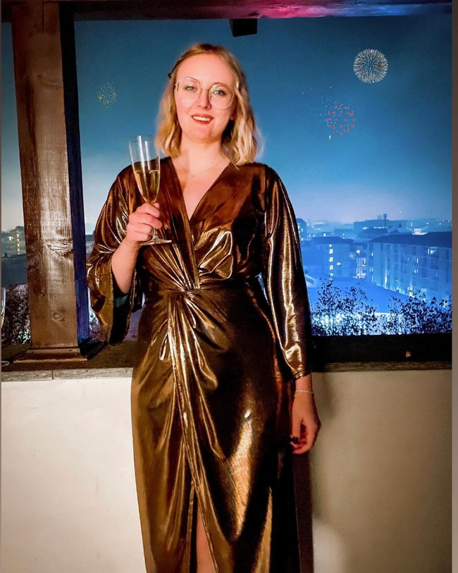 woman celebrating and wearing a diy dress pattern