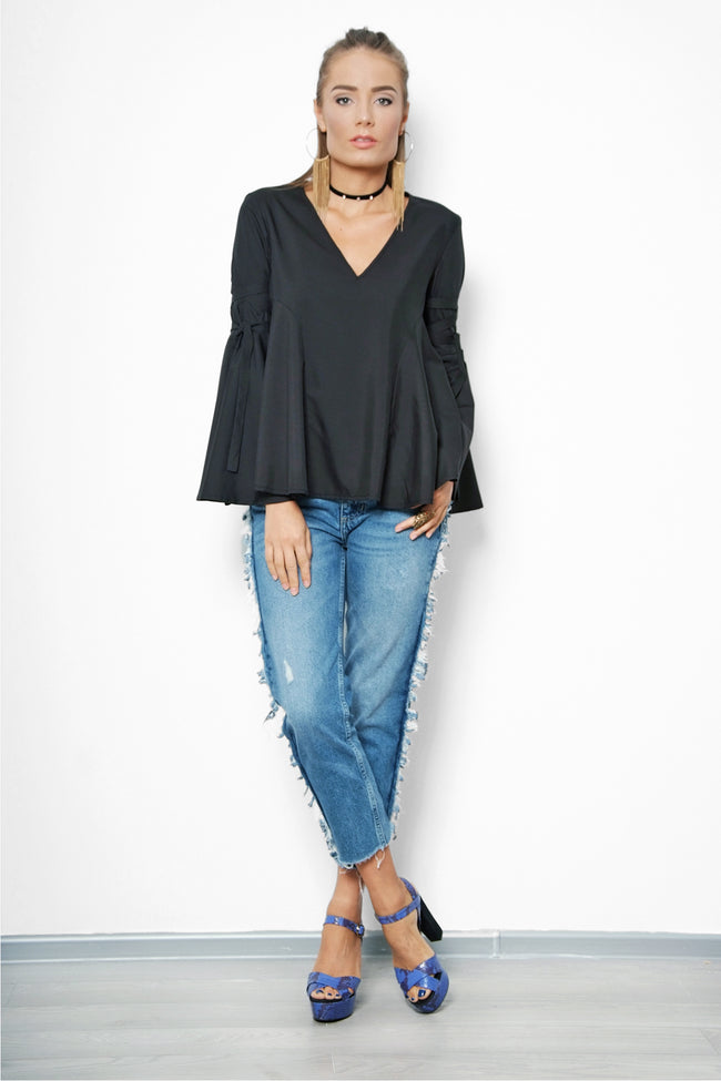 woman posing in a black blouse pattern