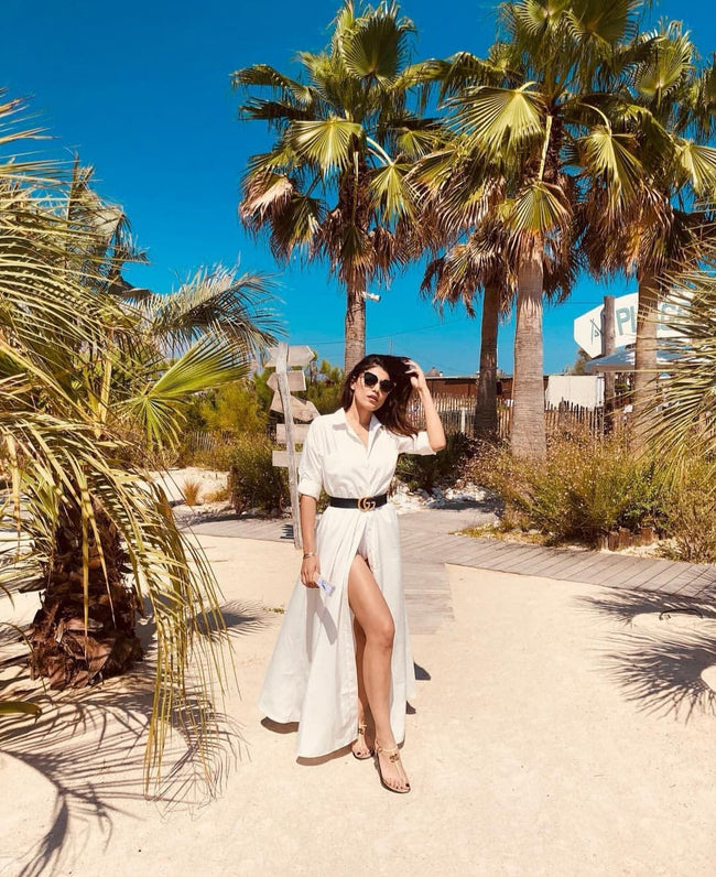 woman on a tropical beach in a white diy sewn maxi shirt dress pattern