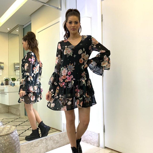 woman posing in a ruffled dress