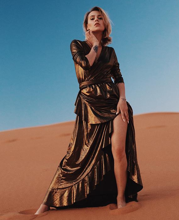 woman posing in dessert in a maxi dress pattern final product