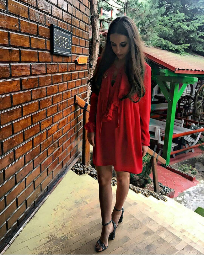 woman sporting a red baby doll dress