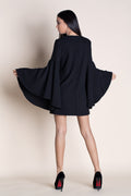 back of a woman wearing a black mini dress pattern