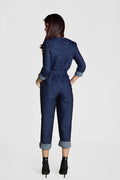 back of a woman posing in a denim jumpsuit sewing pattern