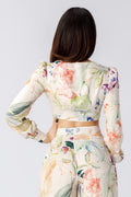 back view of a woman wearing a floral crop top pattern