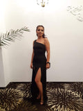 woman in a black one shoulder dress pattern 