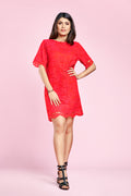 woman posing in a red tshirt dress pattern