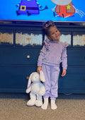 little girl wearing a lilly tracksuit