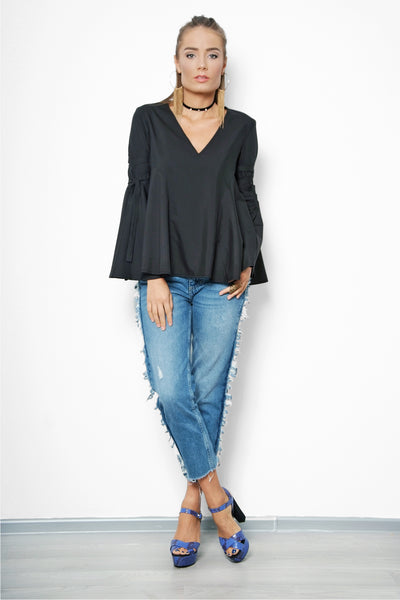 woman posing in a black blouse pattern