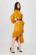 side view of a woman wearing a golden wrap dress pattern