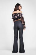 back side of a woman wearin adiy sewn  ruffled off the shoulder crop top sewing pattern and jeans