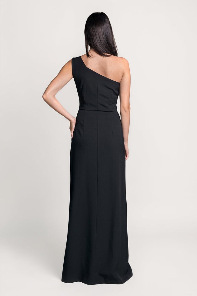 back of a woman in a black maxi dress pattern