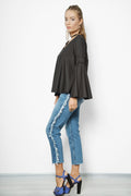 side view of a woman posing for a loose blouse pattern