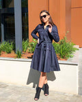 woman wearing a diy sewn skater dress on a sunny day 