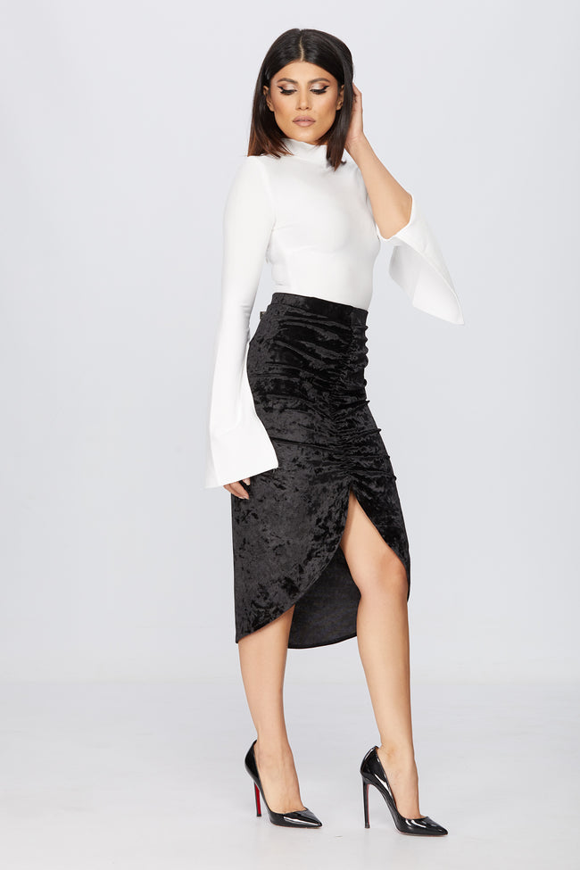 side view of a woman posing in a pencil skirt pattern