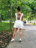 back of a woman in a backless white summer dress pattern