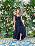 woman posing in a diy sewn ruffle wrap dress pattern