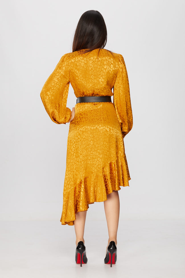 back of a woman in a golden diy sewn wrap dress pattern